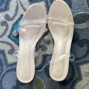 Women’s wedge cream colored sandals with clear straps